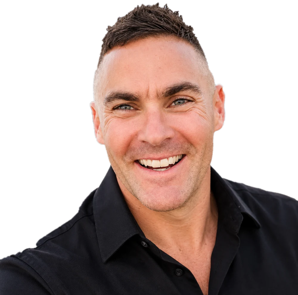 Portrait of Matthew Cassella smiling, in a black shirt